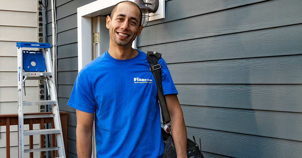 Fixer professional working inside a home